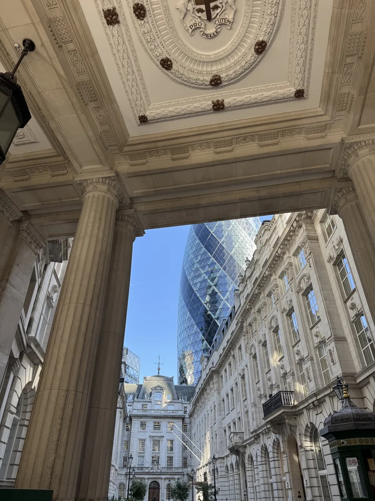 The Gherkin seen through a stone archway in London